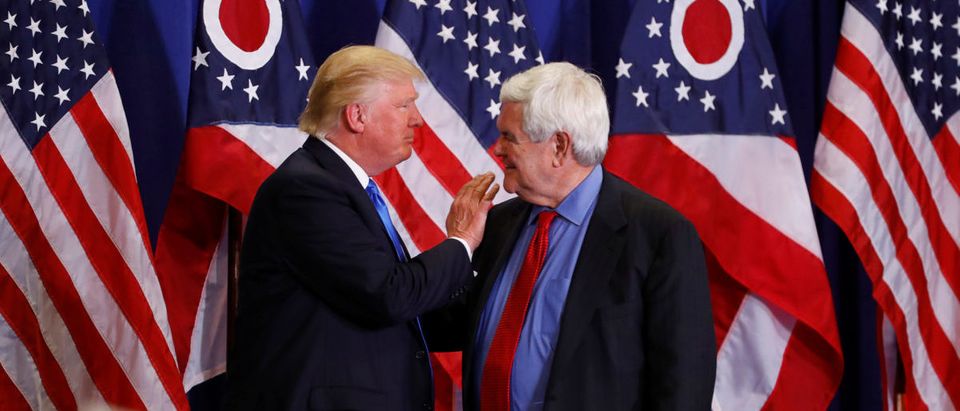 Former Speaker of the House Newt Gingrich greets U.S. Republican presidential candidate Donald Trump at a rally at the Sharonville Convention Center in Cincinnati, Ohio