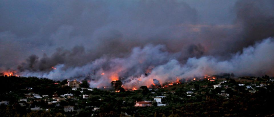 A wildfire rages in the town of Rafina, near Athens, Greece, July 23, 2018. REUTERS/Alkis Konstantinidis