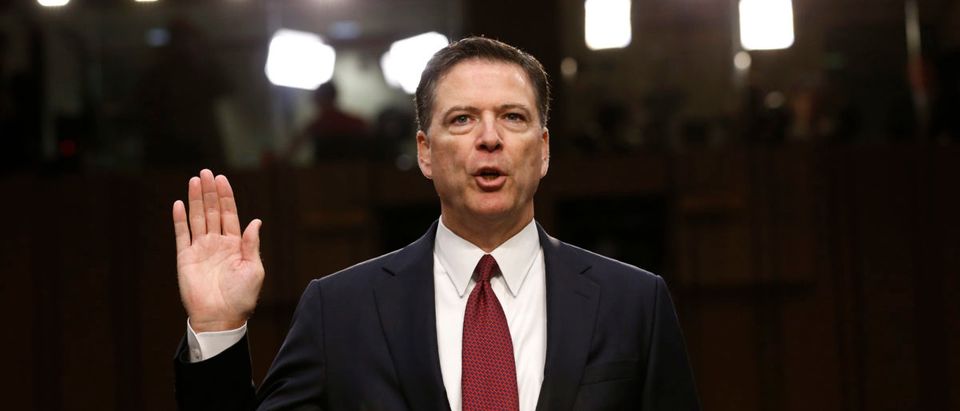 Former FBI Director James Comey sworn in to testify at a hearing in Washington