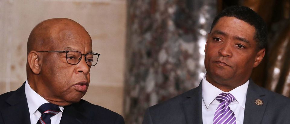WASHINGTON, DC - APRIL 12: Rep. John Lewis (D-GA) (L) and Congressional Black Caucus Chairman Rep. Cedric Richmond (D-LA) participate in a ceremony to mark the 50th anniversary of the assassination of Dr. Martin Luther King Jr. in Statuary Hall at the U.S. Capitol April 12, 2018 in Washington, DC. The House of Representatives memorialized the day that Nobel Peace Prize and American civil rights leader King was killed while supporting a sanitation workers strike in Memphis, Tennessee. (Photo by Chip Somodevilla/Getty Images)