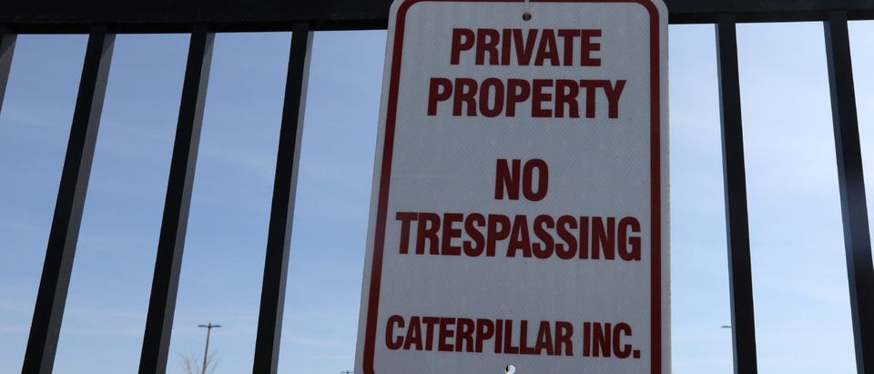 A private property sign is pictured on a fence at a Caterpillar facility in Morton, Illinois, U.S. March 19, 2017. REUTERS/Carlo Allegri