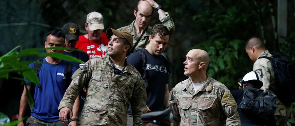 U.S. military personnel come out from Tham Luang cave complex during a search for members of an under-16 soccer team and their coach, in the northern province of Chiang Rai, Thailand, June 28, 2018. REUTERS/Soe Zeya Tun