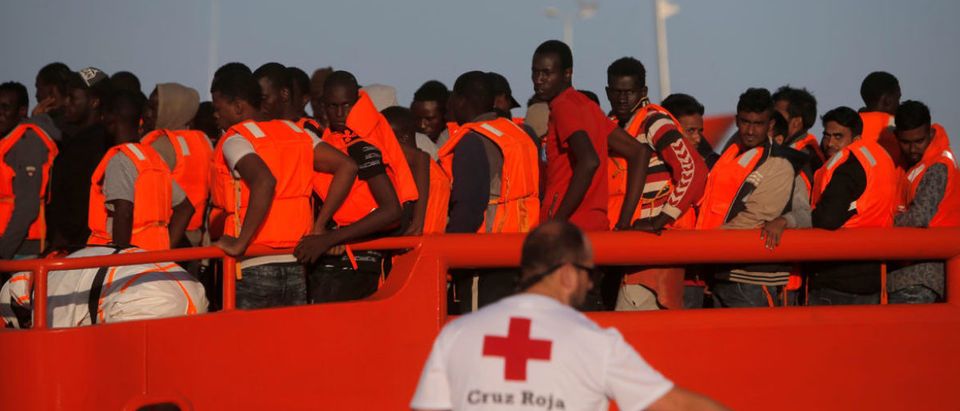 Migrants are seen on a rescue boat after arriving at the port of Malaga