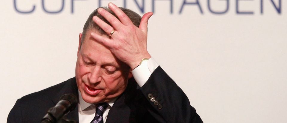 Former US Vice President Al Gore wipes his forehead as he speaks at a presentation on melting ice and snow at the UN Climate Change Conference 2009 in Copenhagen December 14, 2009. REUTERS/Bob Strong
