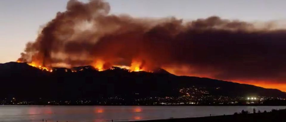 Smoke rises as the Holy Fire spreads along Lake Elsinore