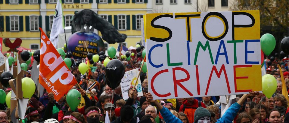 People march during a demonstration under the banner "Protect the climate - stop coal" two days before the start of the COP 23 UN Climate Change Conference hosted by Fiji but held in Bonn