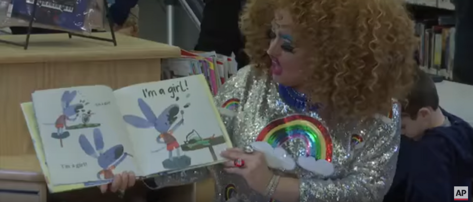 A drag queen reads to children. (Photo Credit: YouTube/AP Archive)