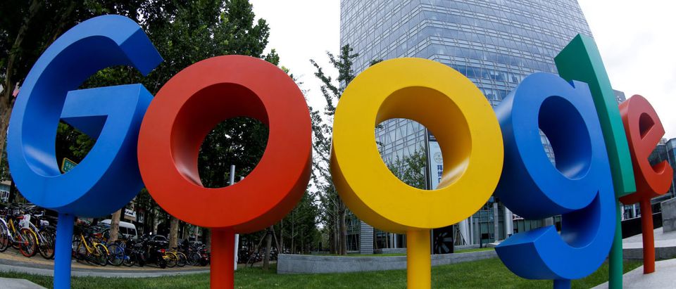 FILE PHOTO: The brand logo of Alphabet Inc's Google is seen outside its office in Beijing, China August 8, 2018. Picture taken with a fisheye lens. REUTERS/Thomas Peter/File Photo