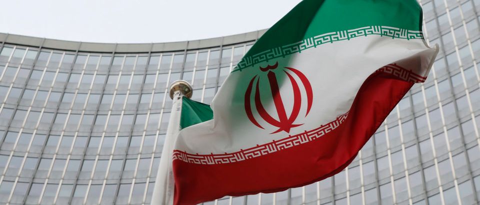 An Iranian flag flutters in front of the IAEA headquarters in Vienna