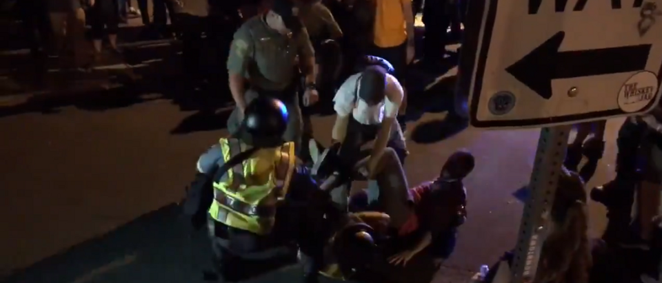 Left wing Charlottesville demonstrators beat police officer (screengrab)