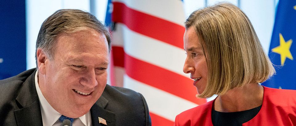 Secretary of State Mike Pompeo, left, and EU Commission Vice President Federica Mogherini, right, speak together at a U.S. E.U. Energy Council Meeting at the European Union's European External Action Service in Brussels