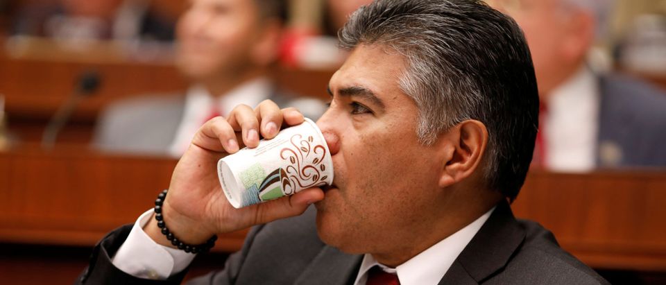 Rep. Tony Cardenas (D-CA) drinks coffee during a marathon House Energy and Commerce Committee hearing on a potential replacement for the Affordable Care Act on Capitol Hill in Washington March 9, 2017. REUTERS/Aaron P. Bernstein