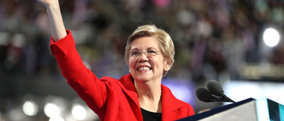 PHILADELPHIA, PA - JULY 25: Sen. Elizabeth Warren (D-MA) acknowledges the crowd as she walks on stage to deliver remarks on the first day of the Democratic National Convention at the Wells Fargo Center, July 25, 2016 in Philadelphia, Pennsylvania. An estimated 50,000 people are expected in Philadelphia, including hundreds of protesters and members of the media. The four-day Democratic National Convention kicked off July 25. (Photo by Joe Raedle/Getty Images)