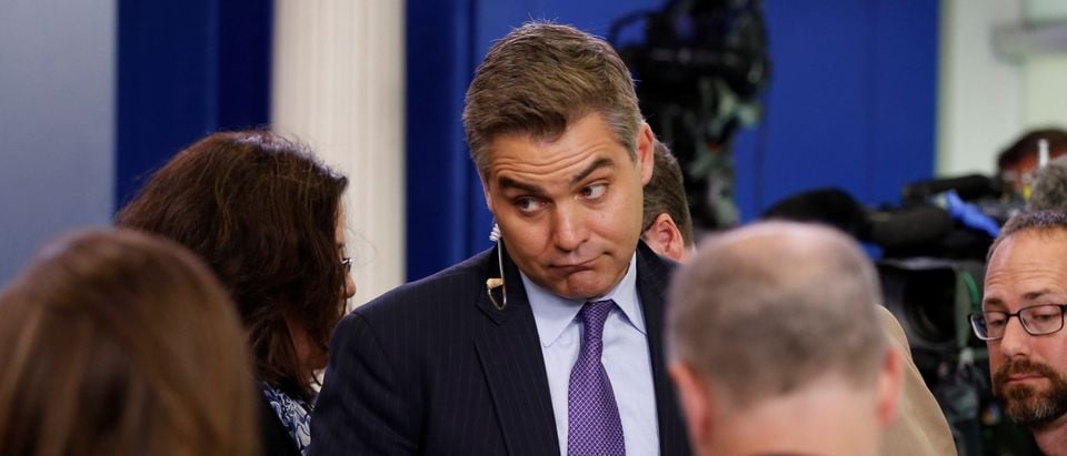CNN White House correspondent Jim Acosta talks with fellow reporters after the daily press briefing, during which he had a contentious exchange with White House senior policy advisor Stephen Miller, at the White House in Washington, U.S. August 2, 2017. REUTERS/Jonathan Ernst