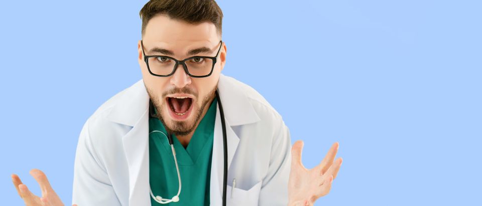 A young doctor shows an expression of surprise. Shutterstock image via user Rapeepat Pornsipak