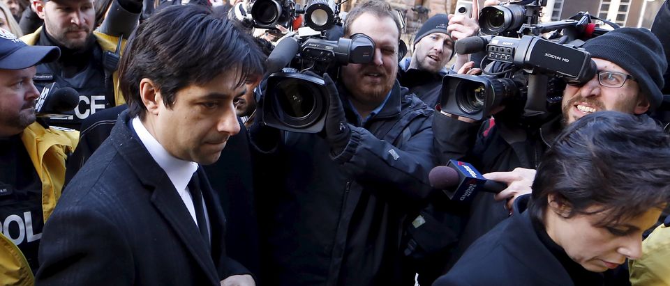 Ghomeshi, a former celebrity radio host who has been charged with multiple counts of sexual assault, leaves the courthouse after the first day of his trial alongside his lawyer Henein in Toronto