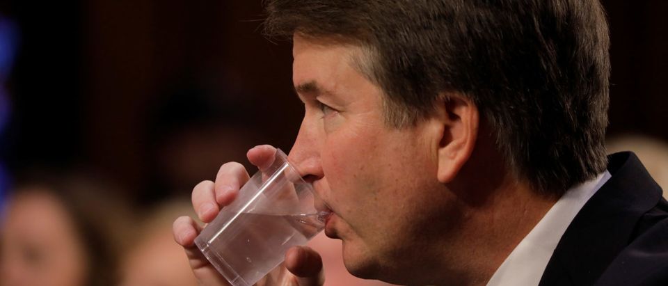 U.S. Supreme Court nominee judge Brett Kavanaugh takes a drink at the start of his Senate Judiciary Committee confirmation hearing on Capitol Hill in Washington, U.S., September 4, 2018. REUTERS/Jim Bourg