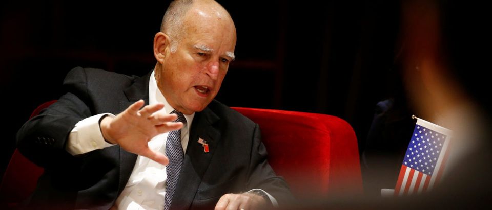 California Governor Jerry Brown attends International Forum on Electric Vehicle Pilot Cities and Industrial Development in Beijing
