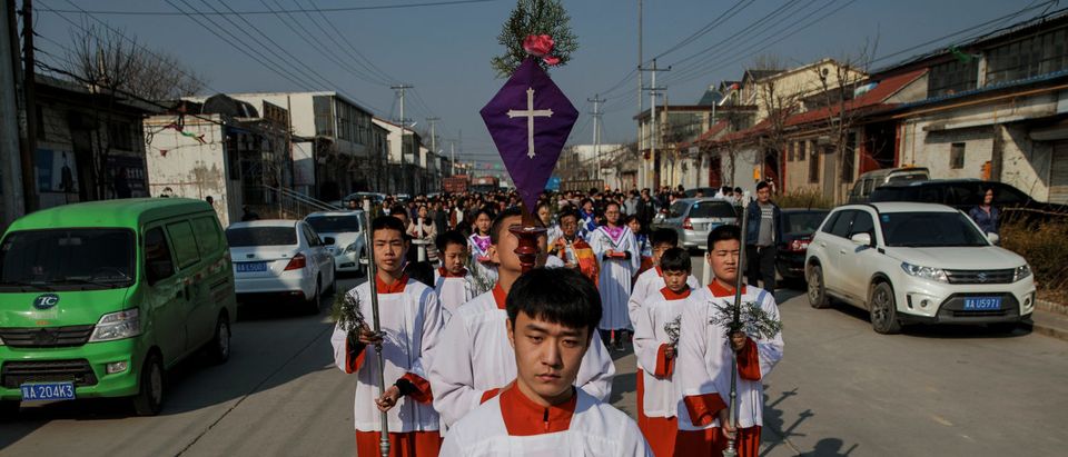 The Palm Sunday procession makes its way towards a government-sanctioned church in Youtong village, Hebei province, China, March 25, 2018. REUTERS/Damir Sagolj