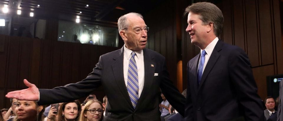 U.S. Supreme Court nominee judge Brett Kavanaugh arrives with Judiciary Committee Chairman Sen. Chuck Grassley (R-IA) for the second day of his confirmation hearing on Capitol Hill in Washington, U.S., September 5, 2018. REUTERS/Chris Wattie