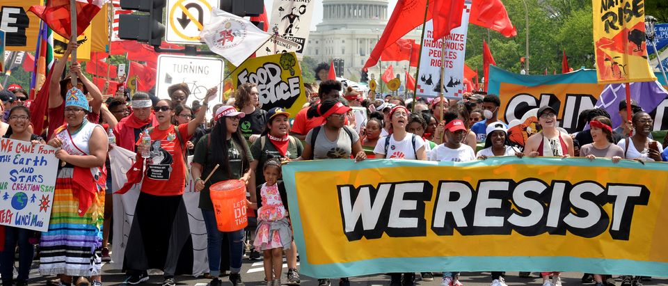Demonstrators march down Pennsylvania Avenue during a People's Climate March, to protest U.S. President Donald Trump's stance on the environment, in Washington, U.S., April 29, 2017. REUTERS/Mike Theiler