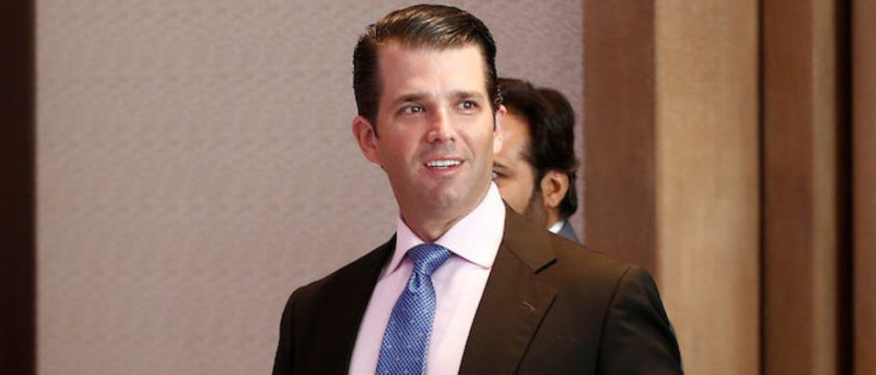 Donald Trump Jr. gestures as he arrives to attend a meeting in New Delhi
