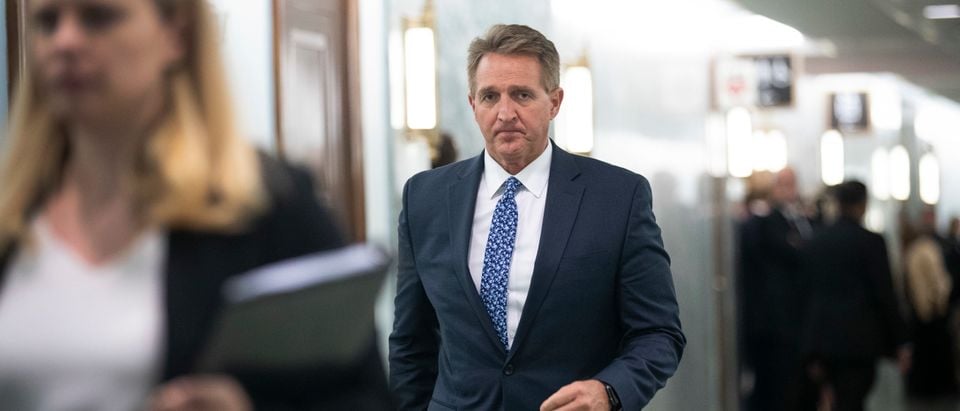 Sen. Jeff Flake (R-AZ) arrives back at the Senate Judiciary Committee hearing following a break, in the Dirksen Senate Office Building on Capitol Hill, September 27, 2018 in Washington, D.C. (Photo by Drew Angerer/Getty Images)