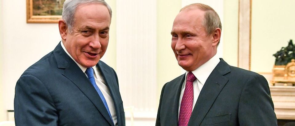 Russian President Putin shakes hands with Israeli PM Netanyahu during their meeting at the Kremlin in Moscow