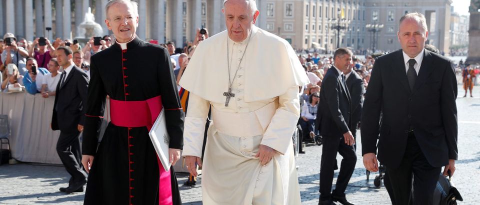 FILE PHOTO: Pope Francis arrives to lead the Wednesday general audience in Saint Peter's square at the Vatican