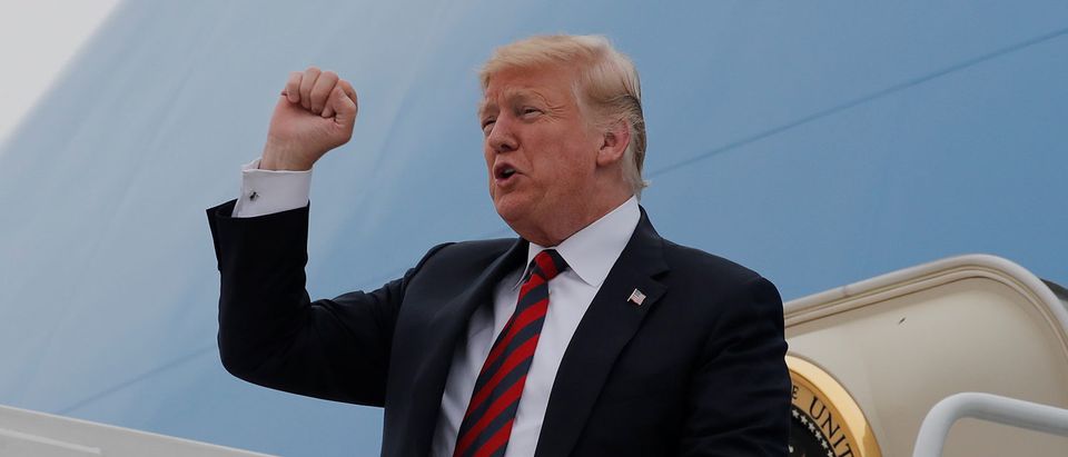 U.S. President Donald Trump pumps his fist upon arriving in Springfield, Missouri, U.S., September 21, 2018. REUTERS/Mike Segar
