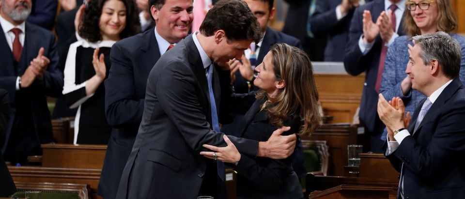 Canada's PM Trudeau embraces Foreign Affairs Minister Freeland after she delivered a speech in the House of Commons in Ottawa