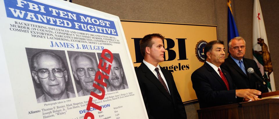 LOS ANGELES, CA - JUNE 23: Steven Martinez, (C) FBI assistant director in charge in Los Angeles, Douglas Price, (L) FBI Assistant Special Agent in Charge, and LAPD Deputy Chief,David Doan, Chief of Detectives, during a news conference to discuss the arrest of Boston crime boss James "Whitey'' Bulger and his companion, Catherine Greig at the Los Angeles Federal Building on June 23, 2011 in Los Angeles, California. The FBI announced June 23, 2011 that Bulger was captured in his home in Santa Monica, California by the FBI after a 26-year manhunt when a tip lead law enforcement to the reputed mobster. (Photo by Kevork Djansezian/Getty Images)