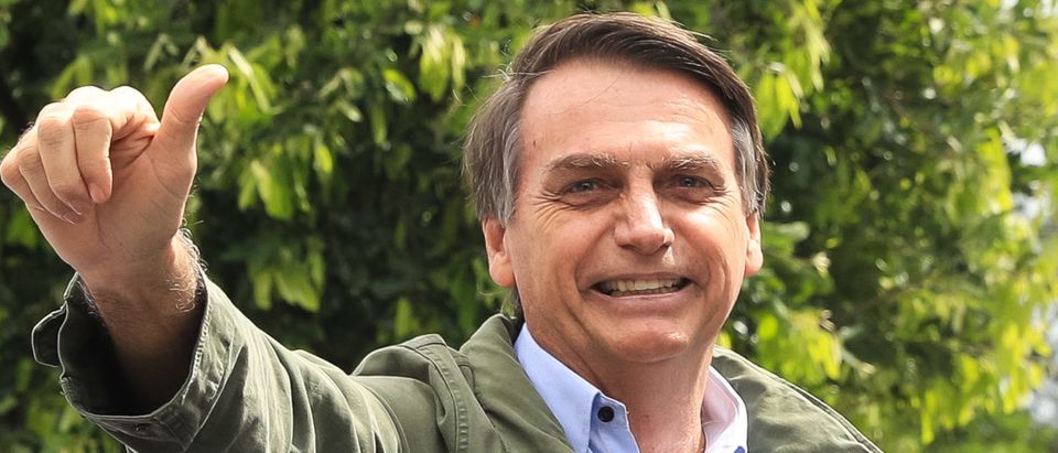 RIO DE JANEIRO, BRAZIL - OCTOBER 28: Jair Bolsonaro, far-right lawmaker and presidential candidate of the Social Liberal Party (PSL), gestures after casting his vote during general elections on October 28, 2018 in Rio de Janeiro, Brazil. (Photo by Buda Mendes/Getty Images)