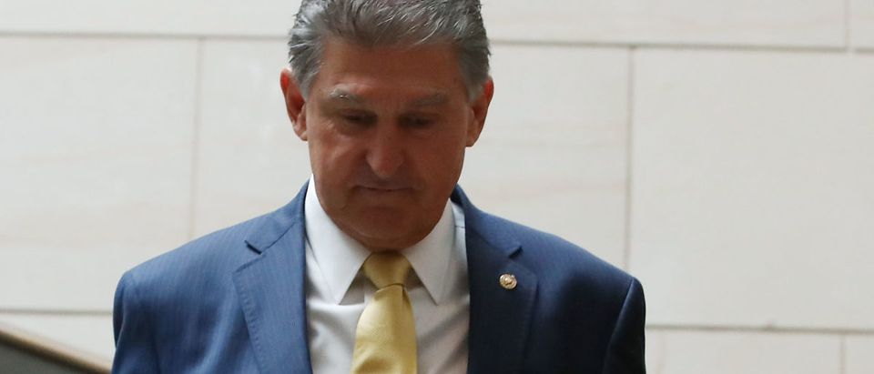 WASHINGTON, D.C. -- OCTOBER 05: Democratic Sen. Joe Manchin of West Virginia walks through the Capitol before a cloture vote on the nomination of Supreme Court Judge Brett Kavanaugh to the U.S. Supreme Court, at the U.S. Capitol, Oct. 5, 2018 in Washington, D.C. Manchin voted "yes" in the 51-49 Senate procedural vote to advance the nomination of Judge Brett Kavanaugh to the U.S. Supreme Court. (Photo by Mark Wilson/Getty Images)