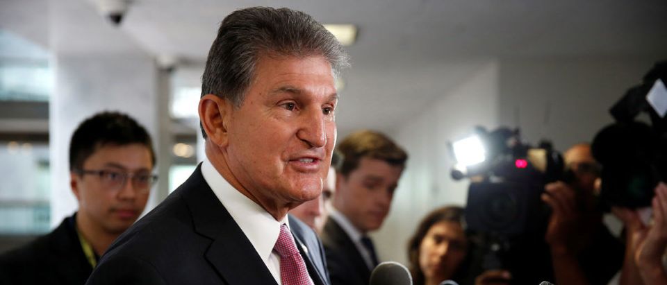 Sen. Joe Manchin speaks to the media as he arrives for a Senate Intelligence Committee hearing evaluating the Intelligence Community Assessment on "Russian Activities and Intentions in Recent US Elections" on Capitol Hill in Washington, U.S., May 16, 2018. REUTERS/Joshua Roberts