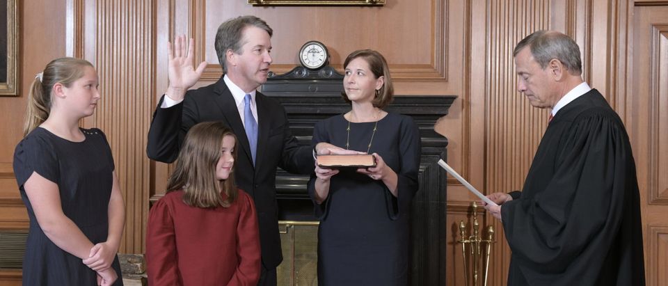 Chief Justice John G. Roberts, Jr., administers the constitutional oath to Brett M. Kavanaugh in the justices’ conference room, Supreme Court Building. Mrs. Ashley Kavanaugh holds the Bible. Credit: Fred Schilling, Collection of the Supreme Court of the United States.