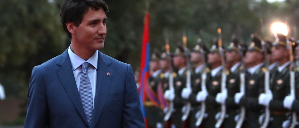 Canadian Prime Minister Justin Trudeau reviews the honour guard at a welcoming ceremony in Yerevan, Armenia October 12, 2018. Picture taken October 12, 2018. REUTERS/Hayk Baghdasaryan/Photolure