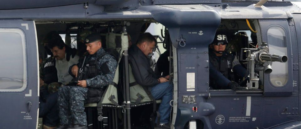 Joaquin "Shorty" Guzman is seen sitting inside a Mexican federal police helicopter at the Navy's airstrip in Mexico City