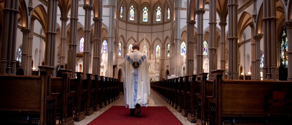 Father Kris Stubna walks to the sanctuary following a mass to celebrate the Assumption of the Blessed Virgin Mary at St Paul Cathedral, the mother church of the Pittsburgh Diocese on Aug. 15, 2018 in Pittsburgh, Pennsylvania. The Pittsburgh Diocese was rocked by revelations of abuse by priests the day before on Aug. 14, 2018. (Photo by Jeff Swensen/Getty Images)