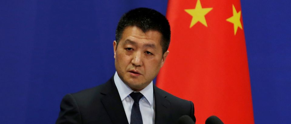 Chinese Foreign Ministry spokesman Lu Kang answers questions about a major bus accident in North Korea, during a news conference in Beijing