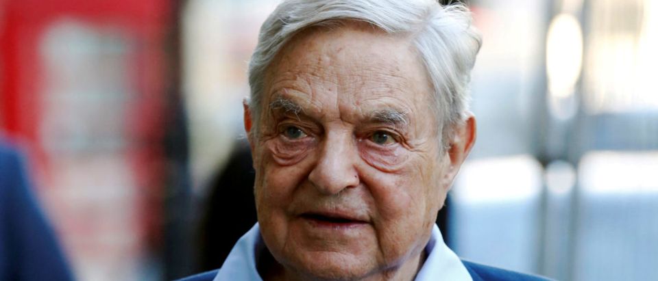 FILE PHOTO: Business magnate George Soros arrives to speak at the Open Russia Club in London