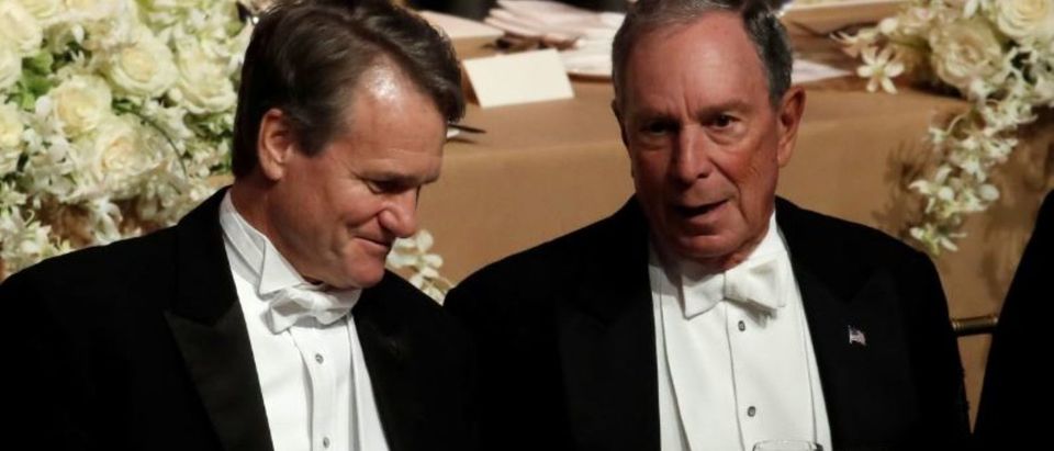 Former New York City Mayor Michael Bloomberg speaks with Bank of America CEO Brian Moynihan (L) at the 73rd Annual Alfred E. Smith Memorial Foundation Dinner in New York City, New York, Oct. 18, 2018. REUTERS/Mike Segar