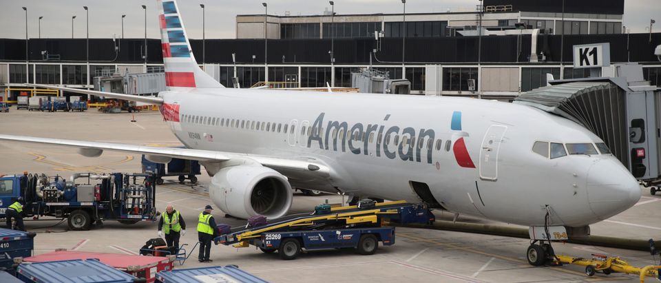 CHICAGO, IL - MAY 11: Workers load luggage onto an American Airlines aricraft at O'Hare International Airport on May 11, 2018 in Chicago, Illinois. Today American Airlines held a ceremony to mark the opening of five new gate at the airport. (Photo by Scott Olson/Getty Images)