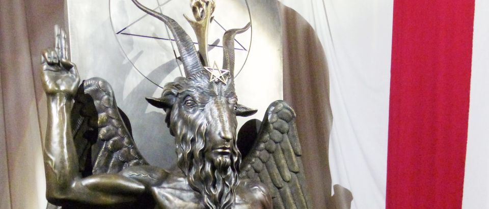 A one-ton, 7-foot (2.13-m) bronze statue of Baphomet -- a goat-headed winged deity that has been associated with satanism and the occult -- is displayed by the Satanic Temple during its opening in Salem, Massachusetts, U.S. September 22, 2016. REUTERS/Ted Siefer