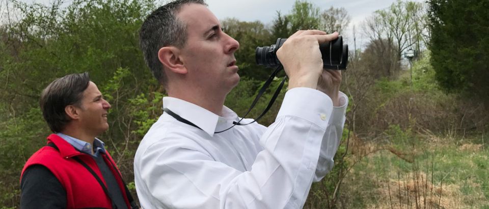 U.S. Rep. Brian Fitzpatrick with Greg Goldman executive director of Audubon Pennsylvania tries to spot a red-winged blackbird in New Hope