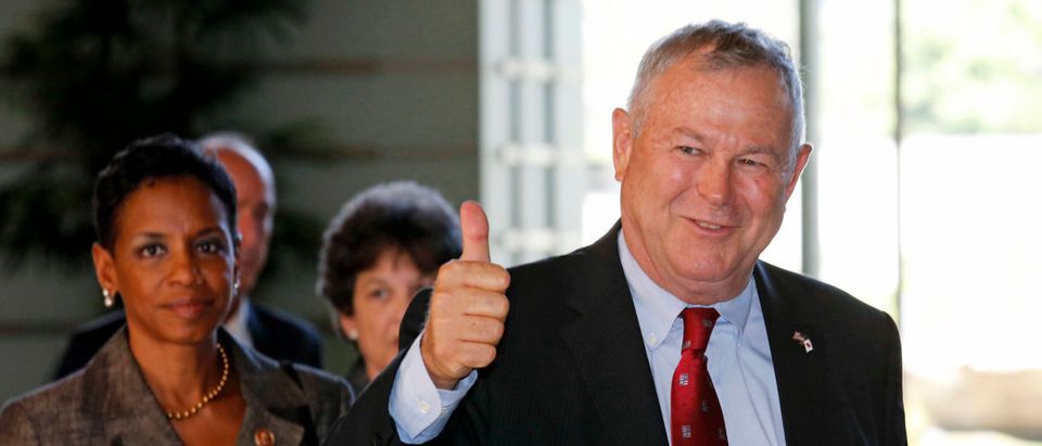 U.S. Representative Dana Rohrabacher gestures as his U.S. Congressional delegation arrives to meet Japanese Prime Minister Shinzo Abe at the Prime Minister's official residence in Tokyo