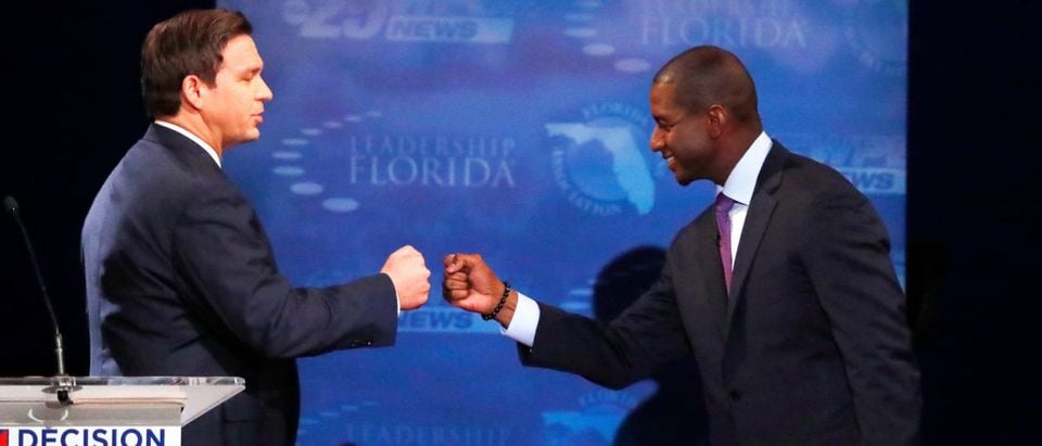 Florida gubernatorial candidates, Republican Ron DeSantis, (L), and Democrat Andrew Gillum fist bump after a debate, at Broward College in Davie, Florida, U.S. October 24, 2018. Wilfredo Lee/ Pool via REUTERS
