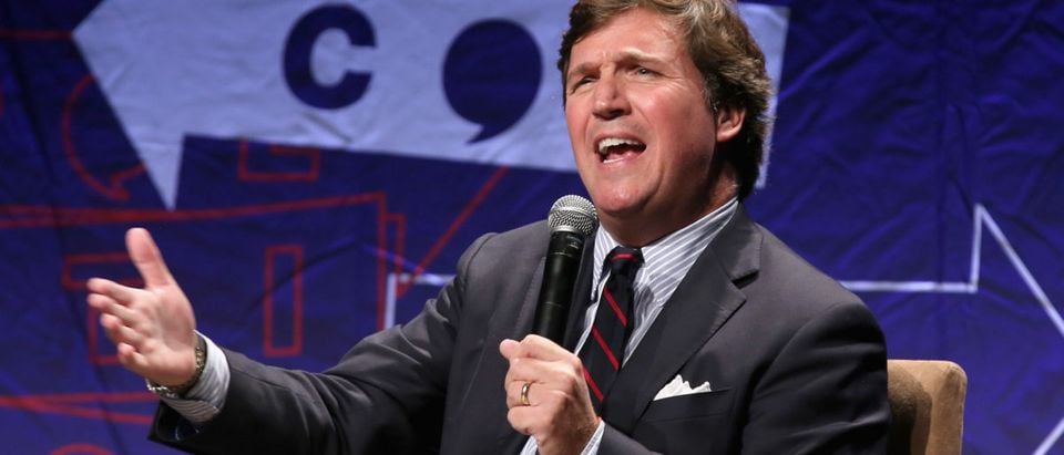 Tucker Carlson speaks onstage during Politicon 2018 at Los Angeles Convention Center on Oct. 21, 2018 in Los Angeles, California. (Photo by Phillip Faraone/Getty Images for Politicon)