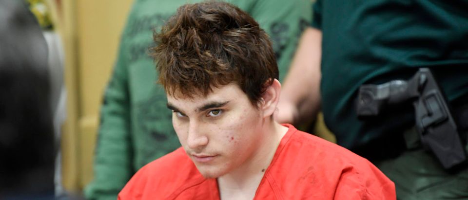 Florida school shooting suspect Nikolas Cruz quickly glances up at the prosecutors during a hearing on April 27, 2018, in Fort Lauderdale, Florida. Taimy Alvarez-Pool/Getty Images