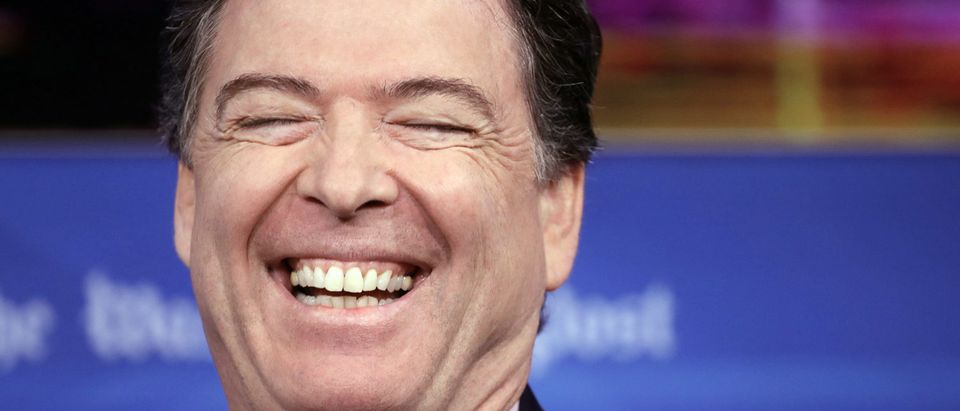 Former FBI director James Comey laughs while answering questions during an interview forum at the Washington Post May 8, 2018 in Washington, DC. Comey discussed his stormy tenure as head of the FBI, his handling of the Hillary Clinton email investigation, his tense relationship with President Trump and his controversial firing a year ago, during the forum. (Photo by Win McNamee/Getty Images)